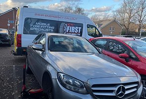 Silver Mercedes car park tyre fitting
